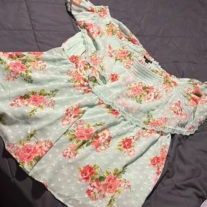 Off the shoulder floral shirt.